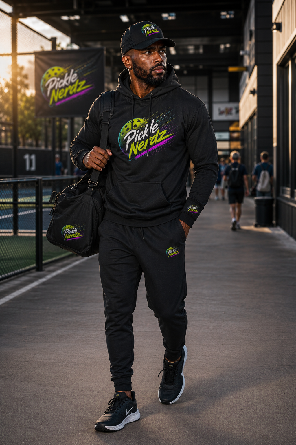 Pickle Nerdz athlete arriving at the court in black branded apparel